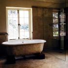 Painted faux marbre bath to match floor, stippled walls, cove painted to match flooring, light dusk painted across ceiling
